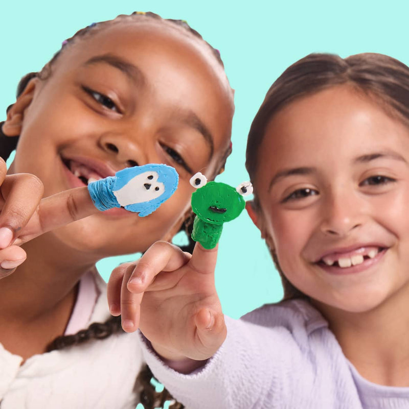 Two children holding finger puppets made with a Start+ 3D pen against a teal background